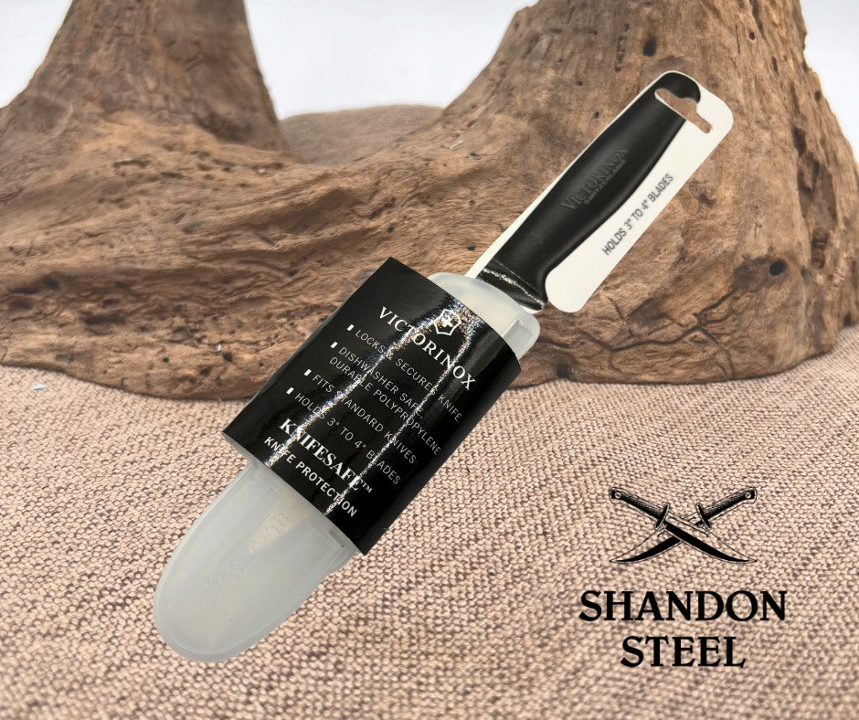 Victorinox knife with black handle and clear sheath on a wooden background