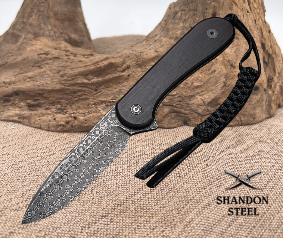 Forked blade knife with black handle and paracord, Shandon Steel branding visible
