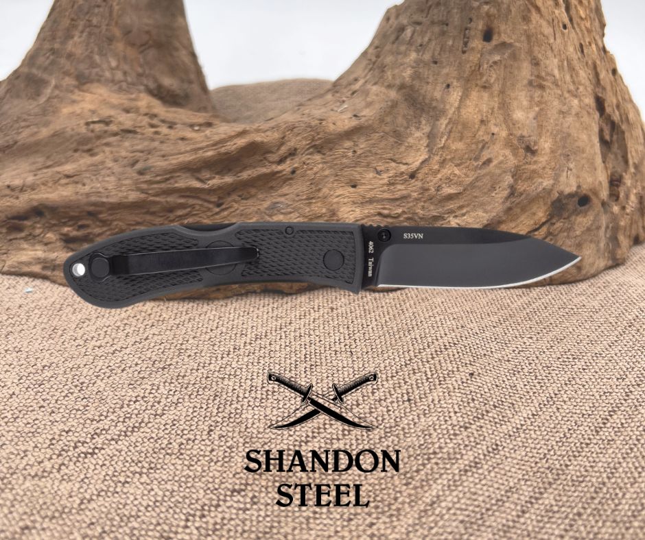 Folding knife with 'Shandon Steel' branding on a textured surface