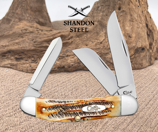 Multi-tool knife with wooden handle and metal blades on a textured surface with 'Shandon Steel' branding.