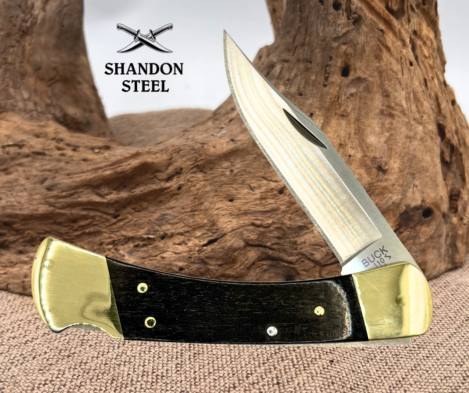 Buck 110 FOLDING  HUNTER,THIN,EBONY,BRASS HDL,MAGNACUT 0110BRS19