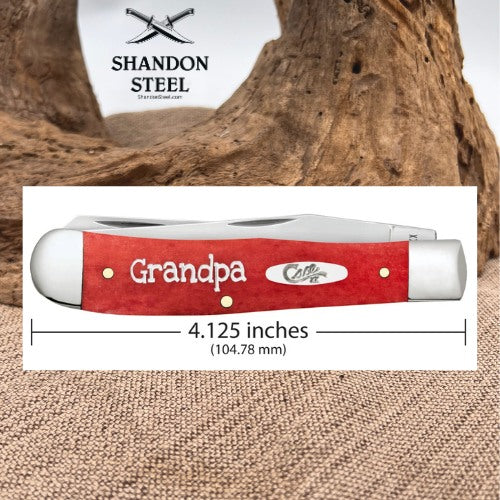 A red pocket knife handle with 'Grandpa' and 'Colten' branding, shown with a dimension line indicating a length of 4.125 inches (104.