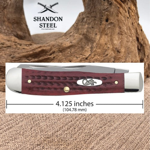 A Shandon Steel folding pocket knife shown in a product graphic with a wood-driftwood background and a measurement label indicating 4.125 inches (104.