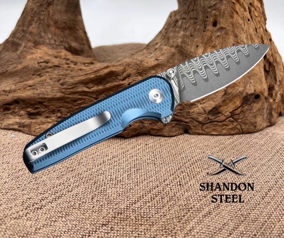 CIVIVI Mini Shakan Flipper & Thumb Stud & Button Lock Knife Ripple Patterned Blue Aluminum Handle (2.48" Damascus Blade) C20052F-DS1
