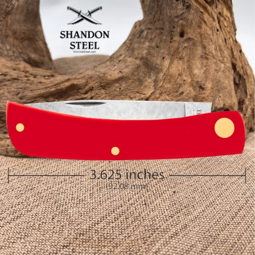 A red folding pocket knife with a silver blade, shown with a dimension overlay indicating a length of 3.625 inches (92.