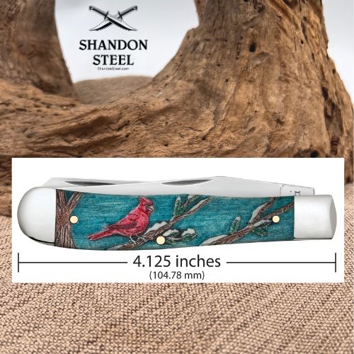 A folded pocket knife with a turquoise and red cardinal illustration on the handle, shown with a white background and measurement label indicating 4.125 inches (104.