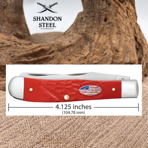 A red folding pocket knife shown on a white measurement panel with printed text indicating a length of 4.125 inches (104.