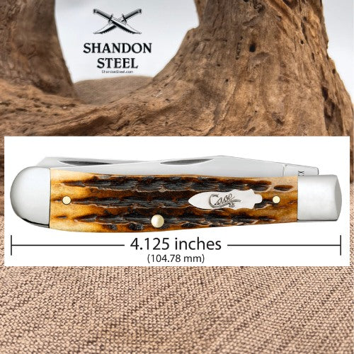 A pocket knife with a brown and amber marbled handle is shown on a white background with a measurement line indicating a length of 4.125 inches (104.