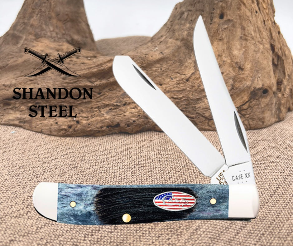 Foldable knife with blue handle and American flag design, branded 'Shandon Steel' and 'Case XX'.