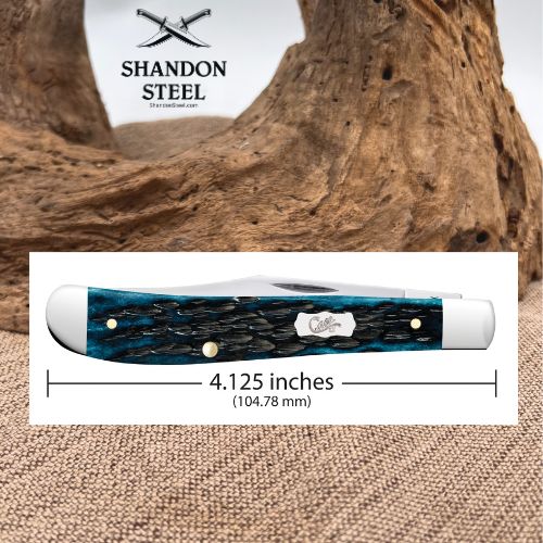 A Shandon Steel folding pocket knife with a blue and black marbled handle, shown with a dimension overlay indicating a length of 4.125 inches (104.