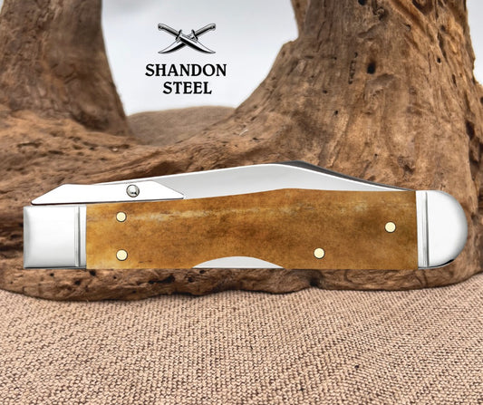 Case XX Smooth Antique Bone Cheetah® Cub with Fluted Bolsters (611 1/2L SS) 58214