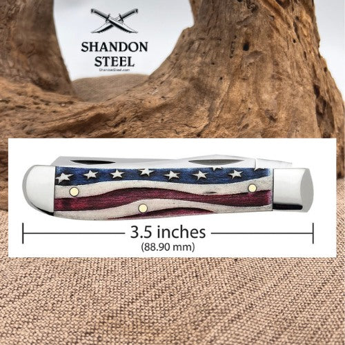 A pocket knife with an American flag pattern handle, shown with a dimension overlay indicating 3.5 inches (88.