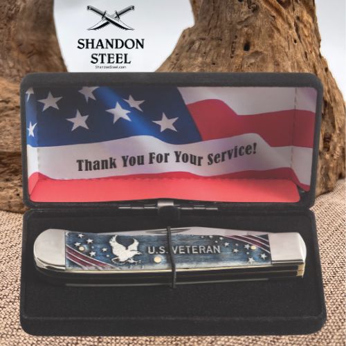 A folded pocket knife with a patriotic American flag design and 'U.S.