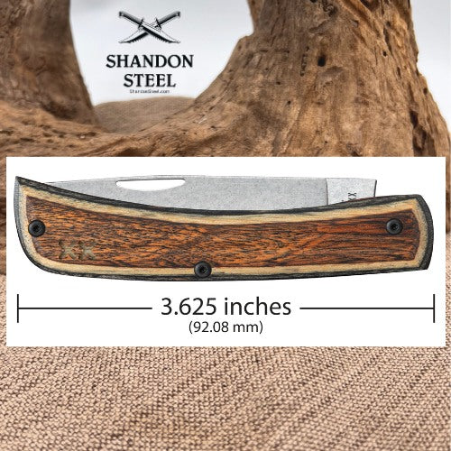A folding pocket knife with a brown wood-grain handle and silver metal blade, shown on a white background with a measurement line indicating 3.625 inches (92.