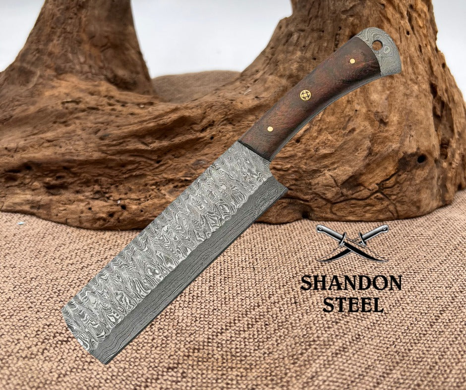 Knife with a wooden handle on a textured surface, branded 'Shandon Steel'.