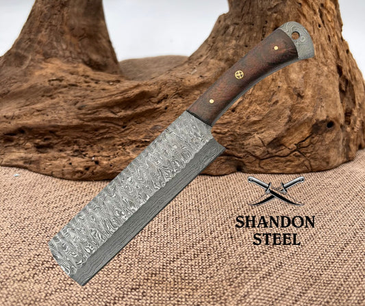 Knife with a wooden handle on a textured surface, branded 'Shandon Steel'.