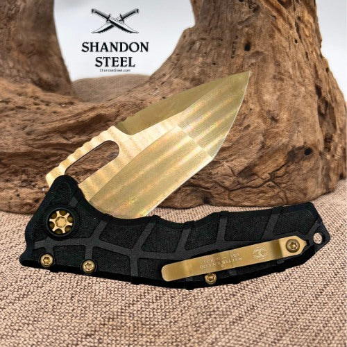 Heretic Martyr Recurve Bronze Stonewash / Black Chassis – MagnaCut – H056-7A