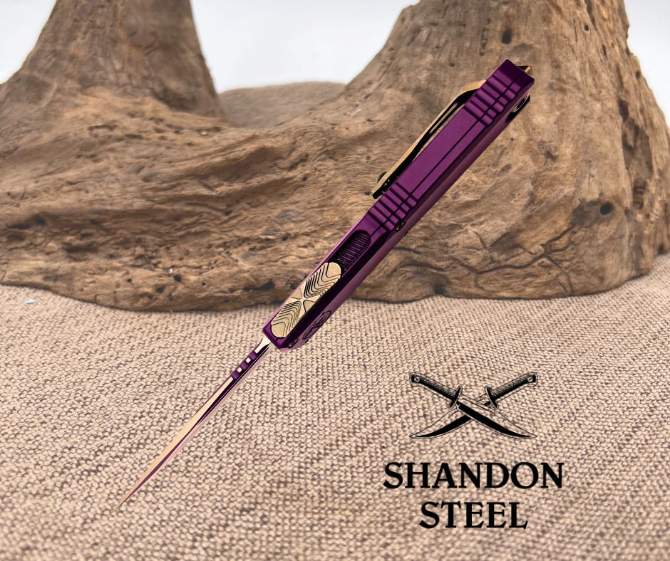 Purple pen with decorative elements on a textured surface, featuring the Shandon Steel logo.