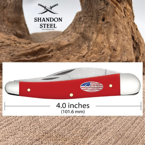 A red and silver pocket knife with a small American flag emblem on the handle, shown on a white measurement panel with text reading 4.0 inches (101.